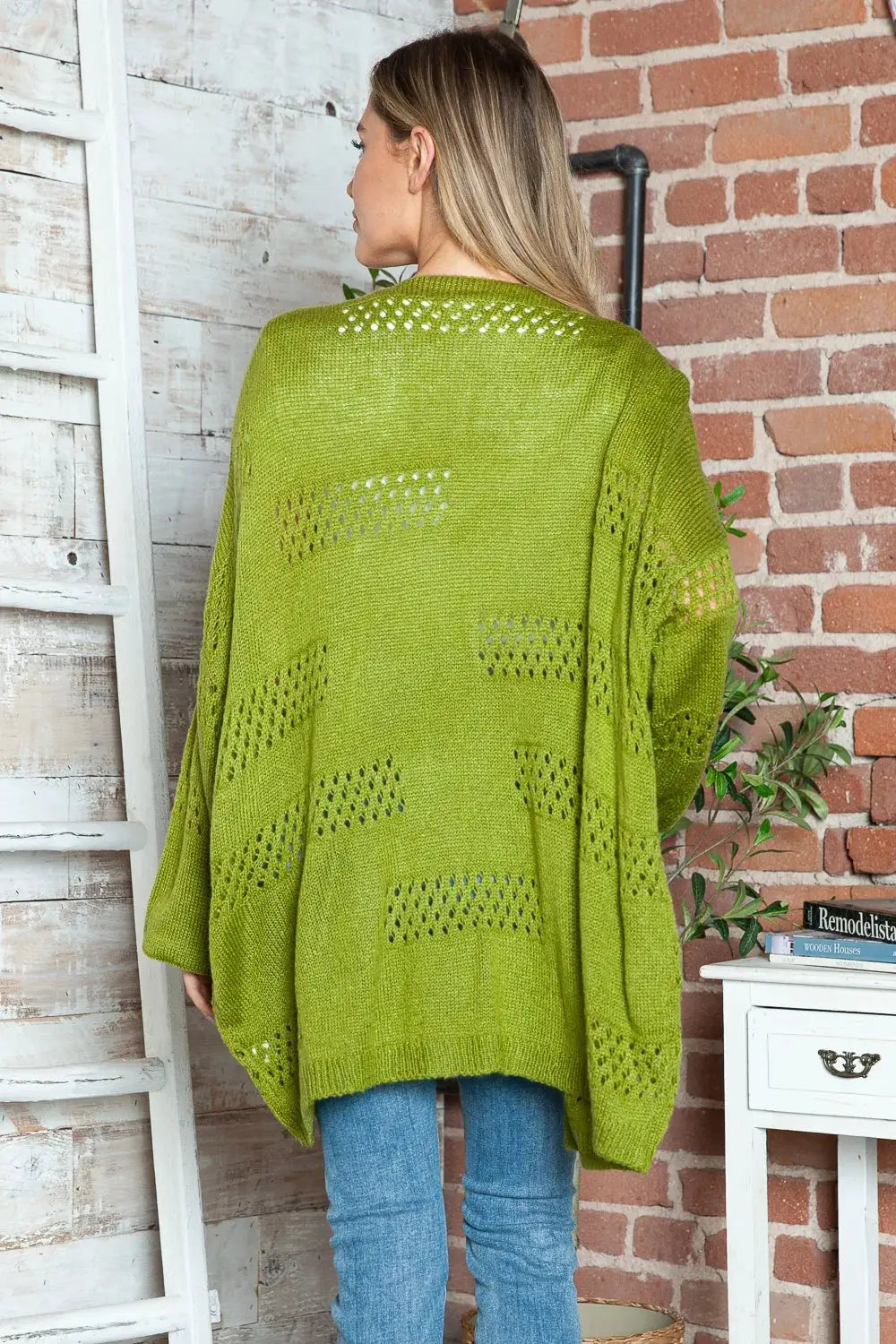 Openwork open-front long-sleeve stretchy acrylic cardigan in lime green with open-knit panels.