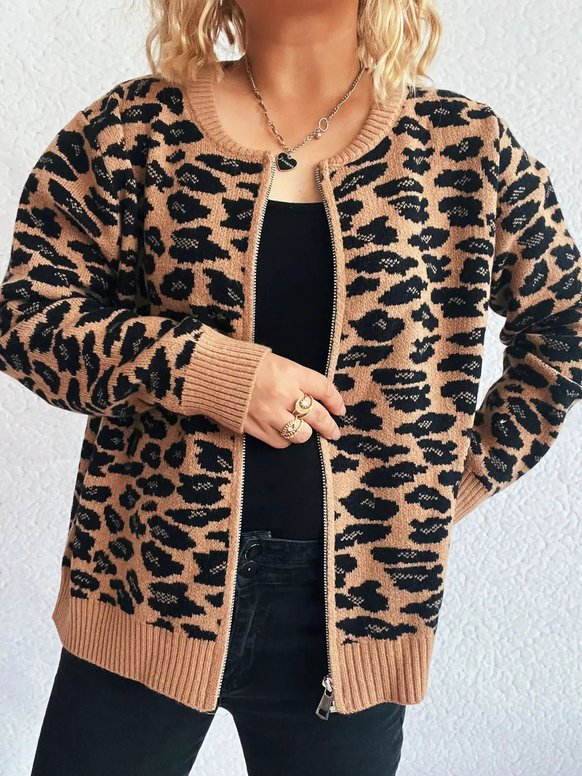 Zip-up leopard-print cardigan by Trendsi in tan and black; front zipper, ribbed cuffs and hem, long sleeves.