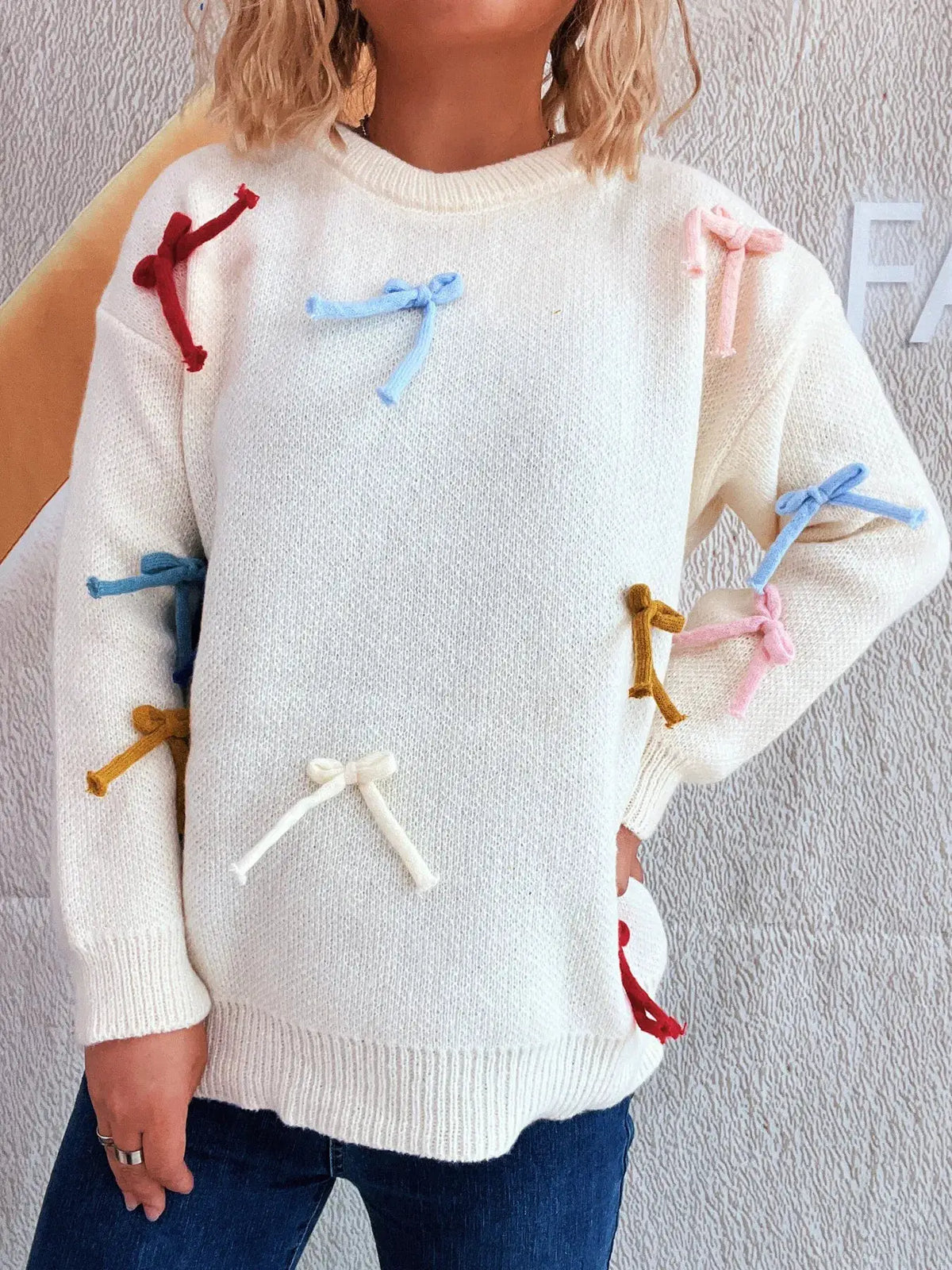 Vibrant Bow Accent Round Neck Sweater white knit with multicolor bows along sleeves