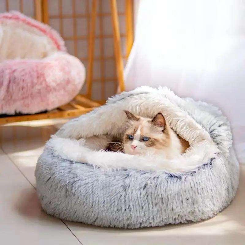 Semi-closed plush cat bed nest in light gray with white interior; two beds shown, pink bed in background.