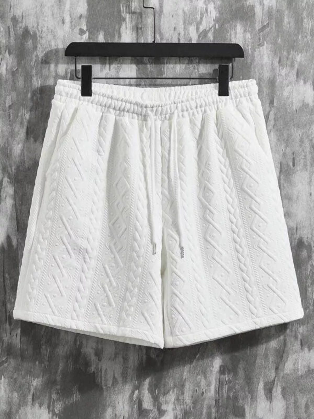 Men's white textured knit shorts with elastic waistband and drawstring