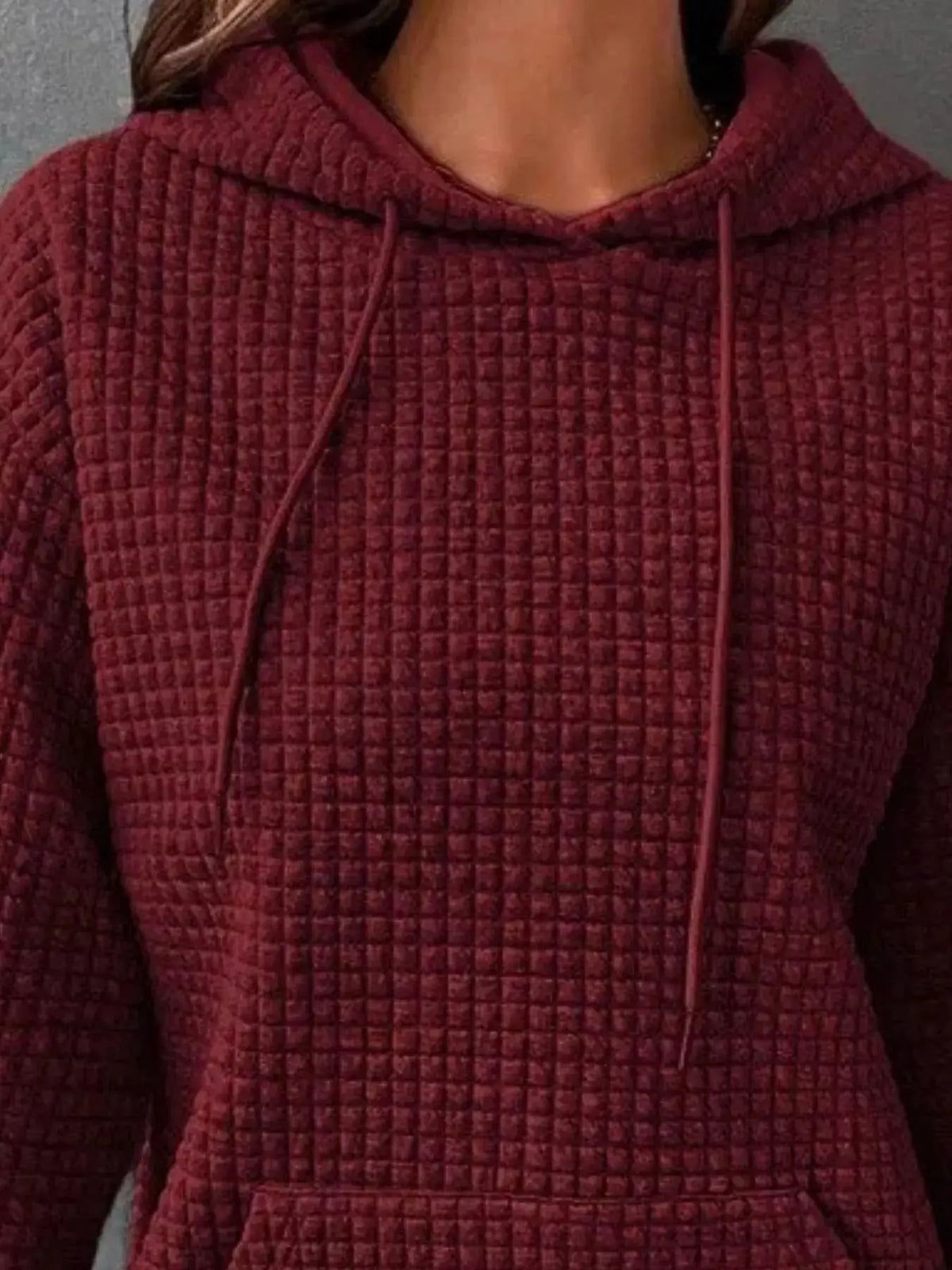 Full Size Textured Kangaroo Pocket Hoodie Plus Size by Trendsi in maroon quilted fabric.