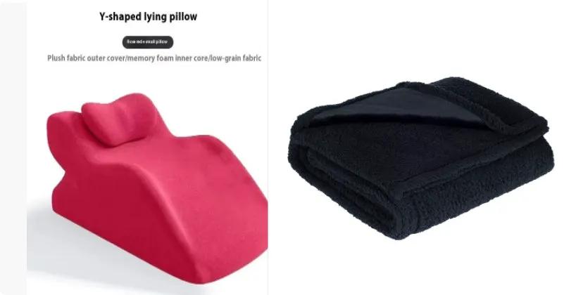 Y-shaped lying pillow in pink beside a folded black waterproof flannel cotton-velvet blanket