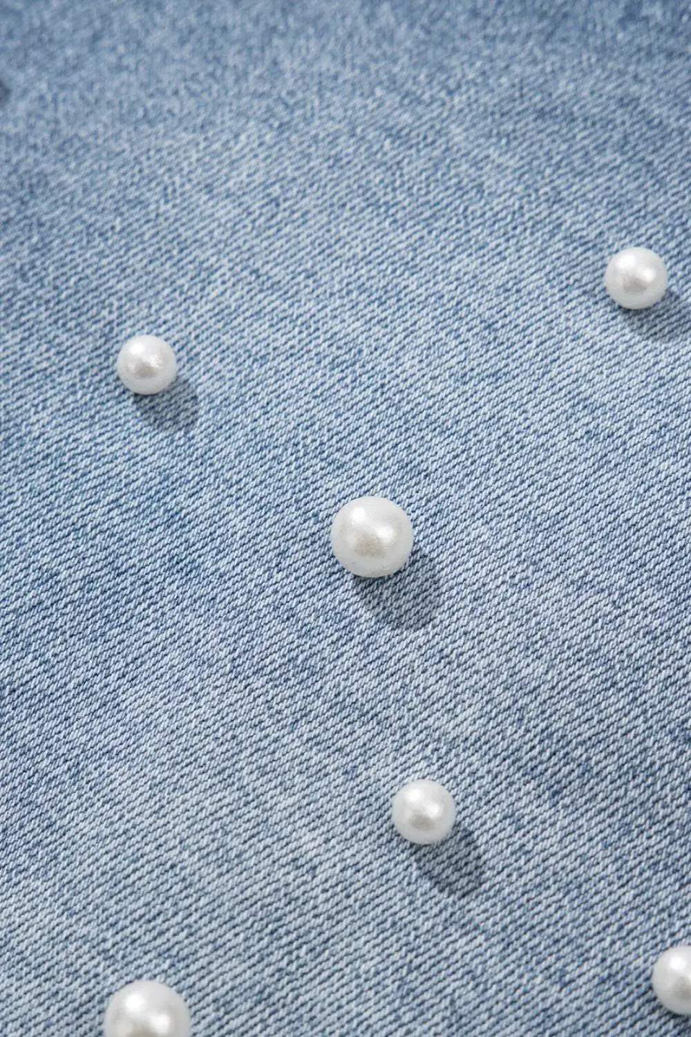 Classic pearl-beaded light-wash denim shorts with pearl embellishments