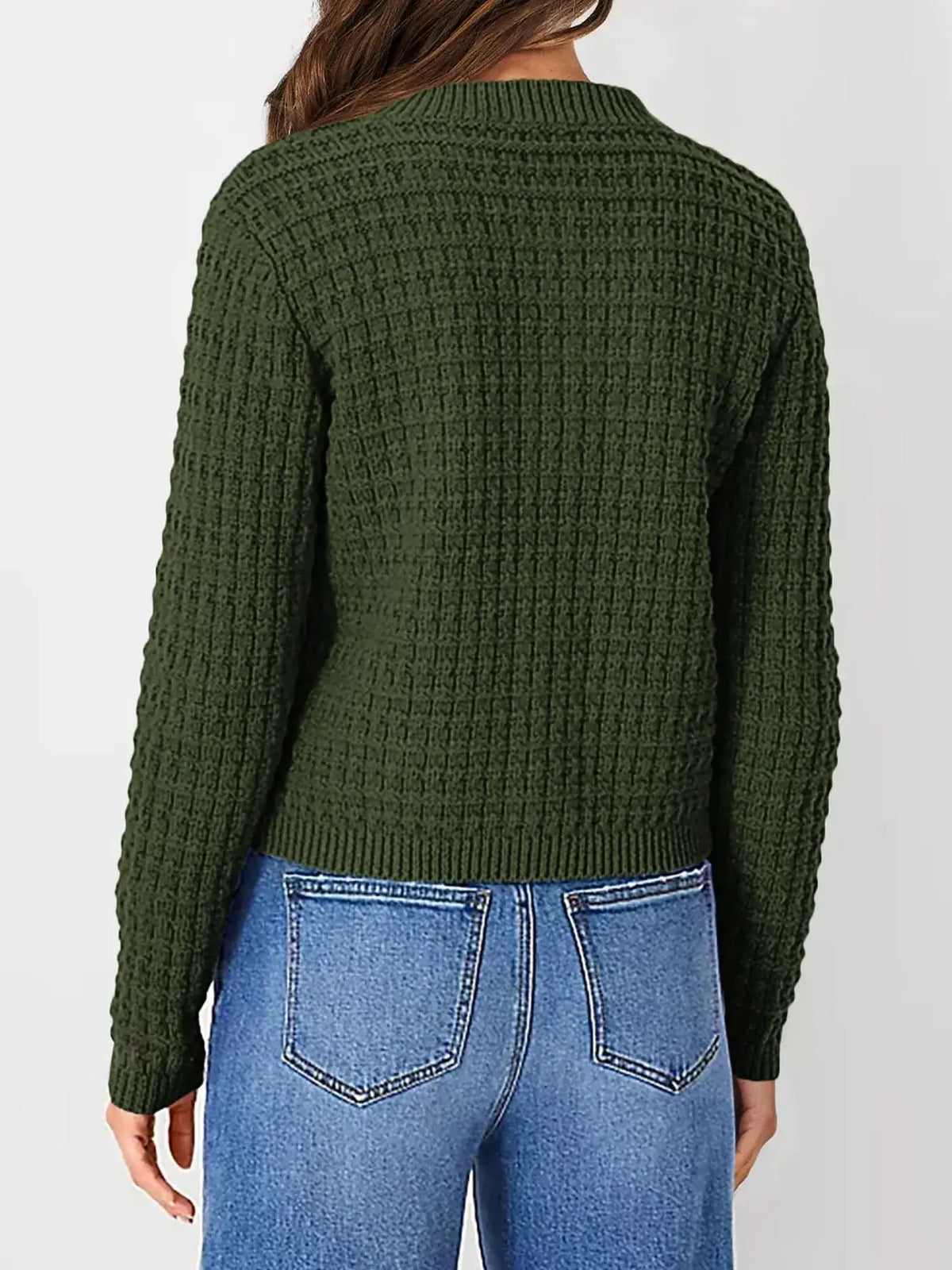 Textured olive-green stretchy knit cardigan with button front, cropped length, paired with blue denim jeans