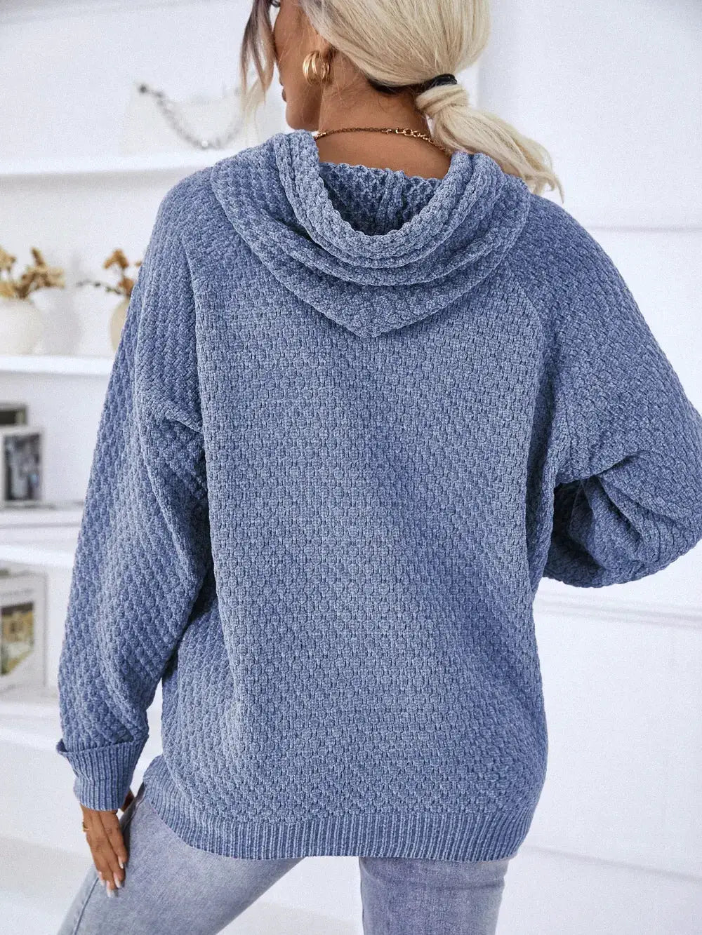 Textured drawstring hoodie sweater, blue premium polyester with drawstring hood.