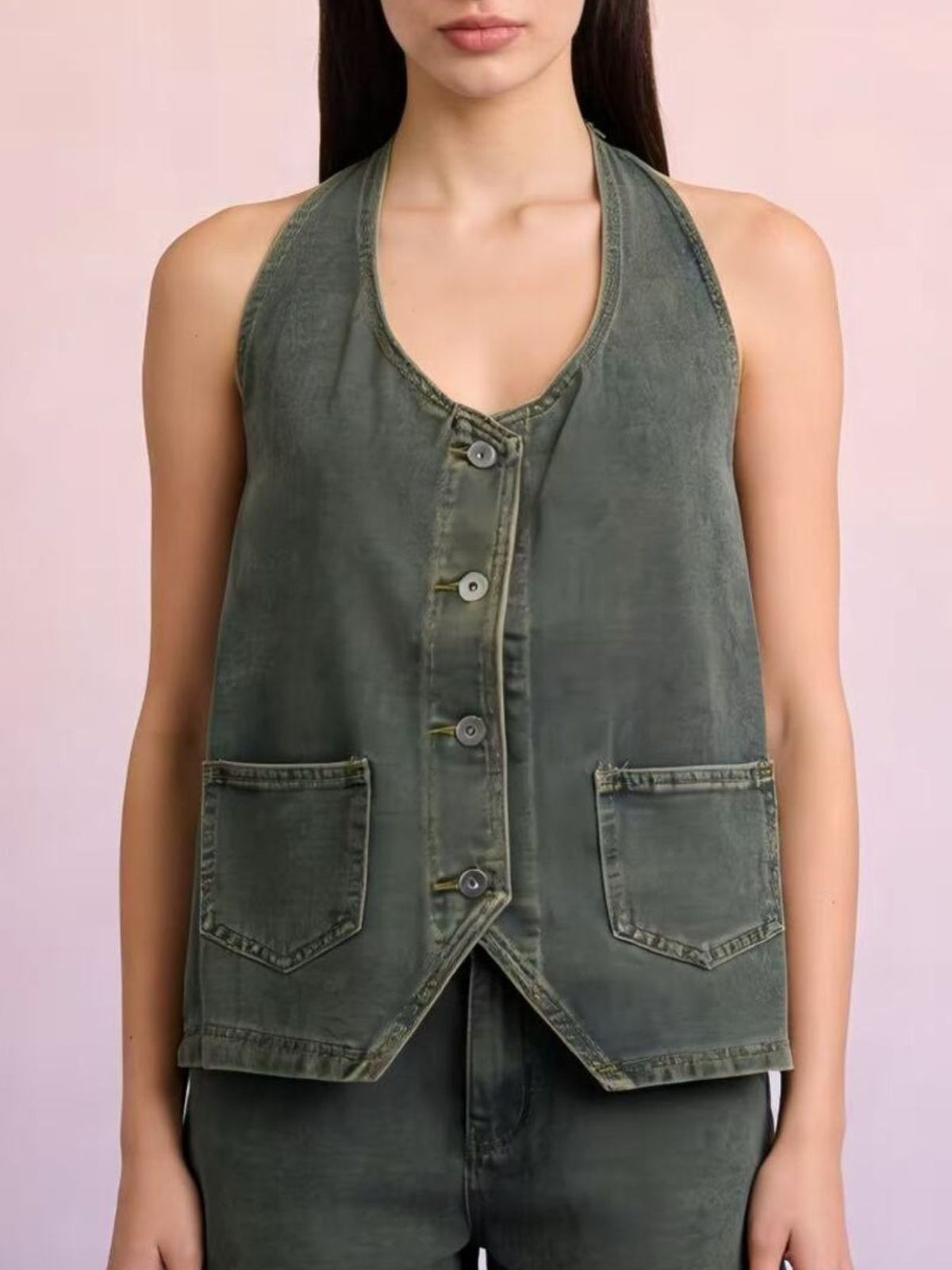 Halter-neck denim vest in olive green with front button placket, adjustable tie hem, and patch pockets