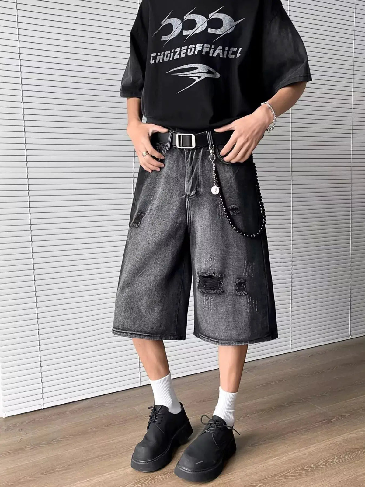 Men's full-size distressed wide-leg denim shorts in black wash with belt
