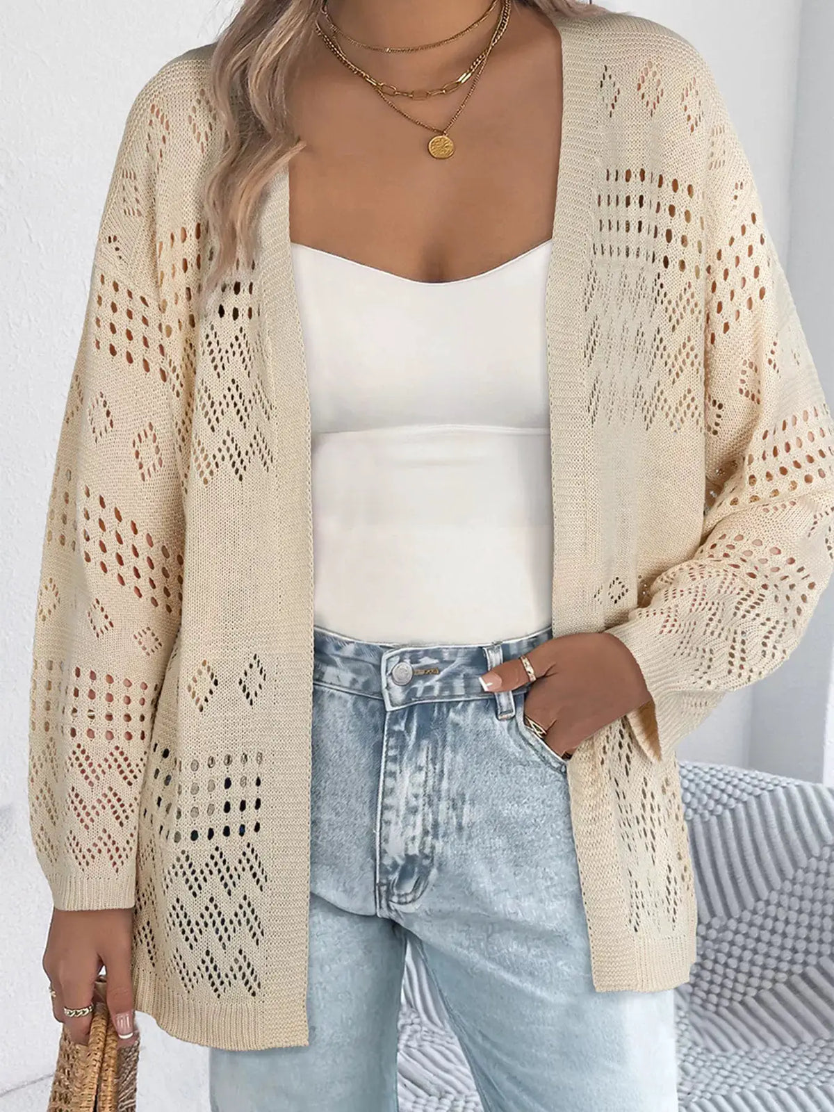 Trendsi beige hollow-knit open-front cardigan with side pockets over white top and jeans