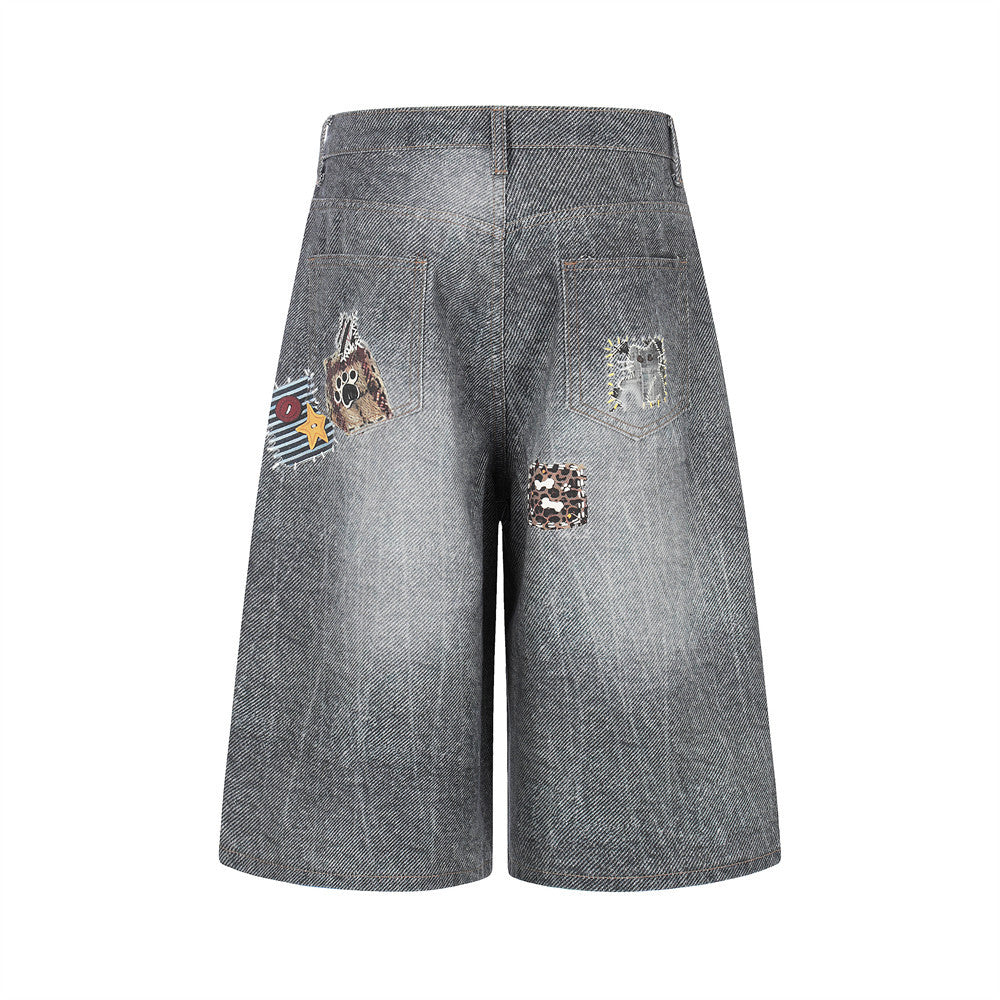 Denim patchwork shorts with decorative back-pocket patches; mid-wash blue, eprolo