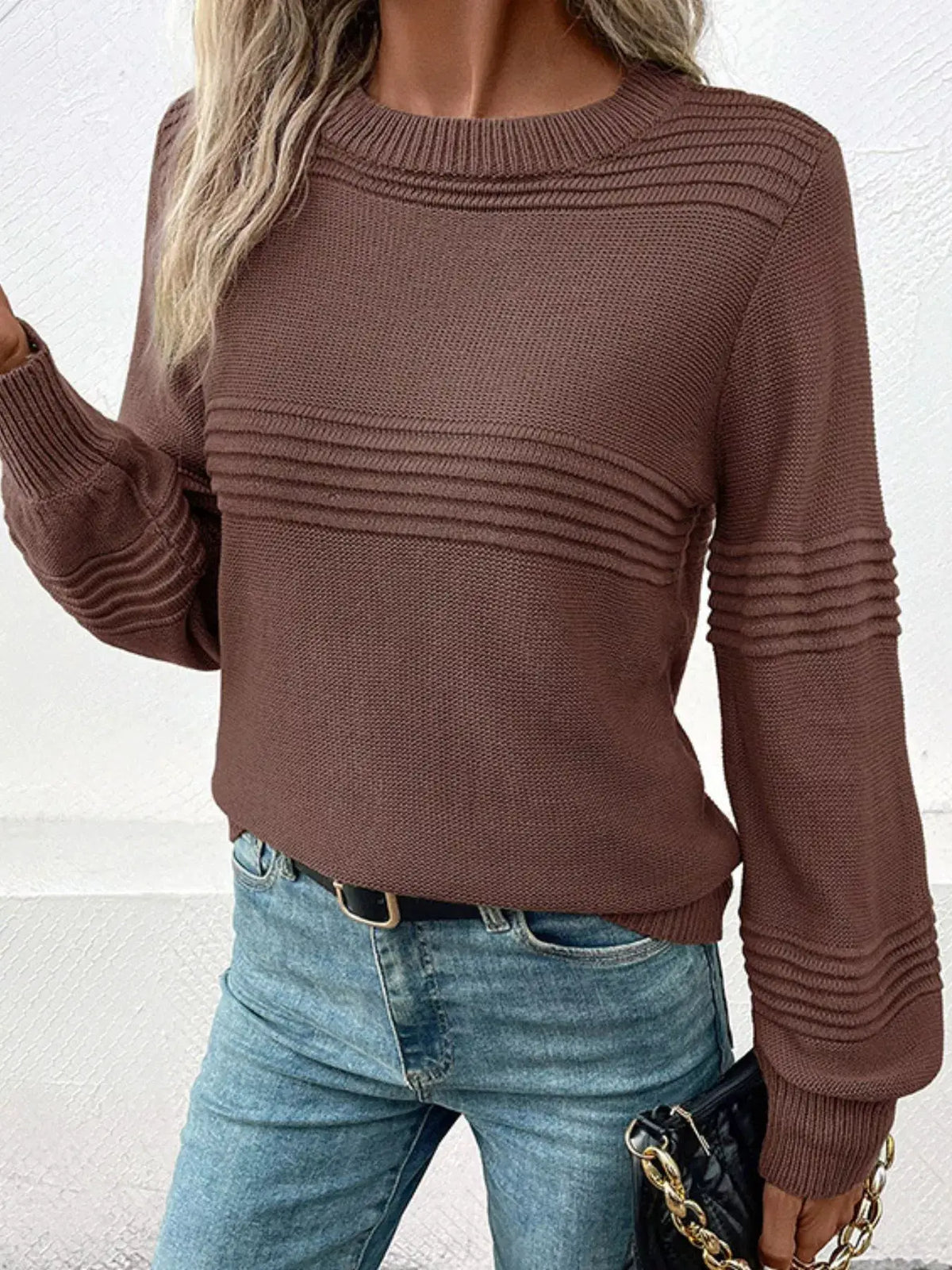 Cozy acrylic round-neck sweater with stretch fit in brown; ribbed panels across chest and sleeves