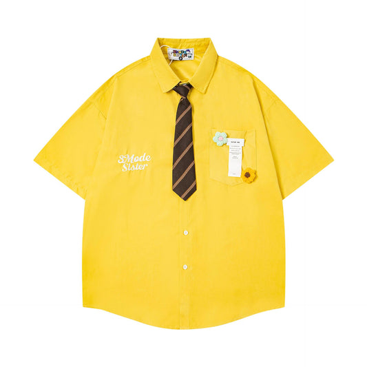 Chemise brodée fleur broche dopamine