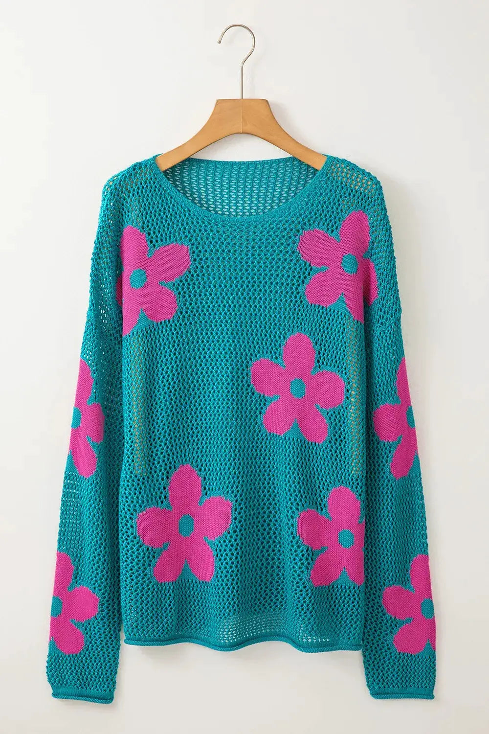Lightweight openwork floral knit cover-up top in teal with pink flowers, round neck.