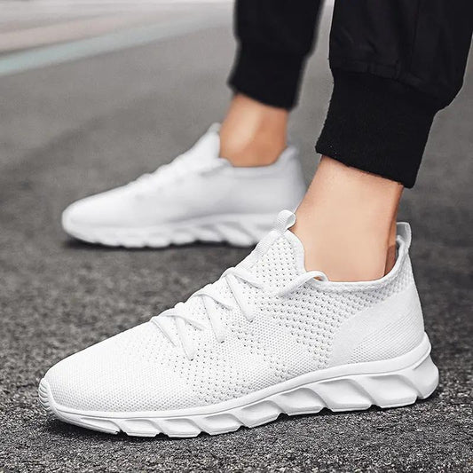 StriaRun breathable mesh-upper running shoes, white AdTec sneakers on pavement.