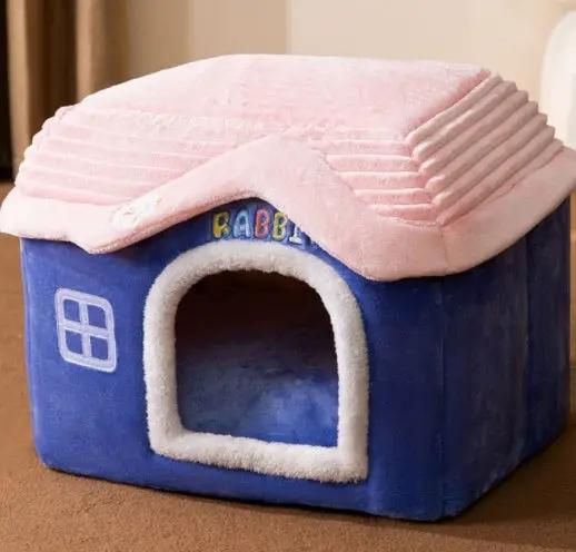 AdTec foldable dog house and cat bed; blue cube with pink plush roof and white-trimmed doorway.