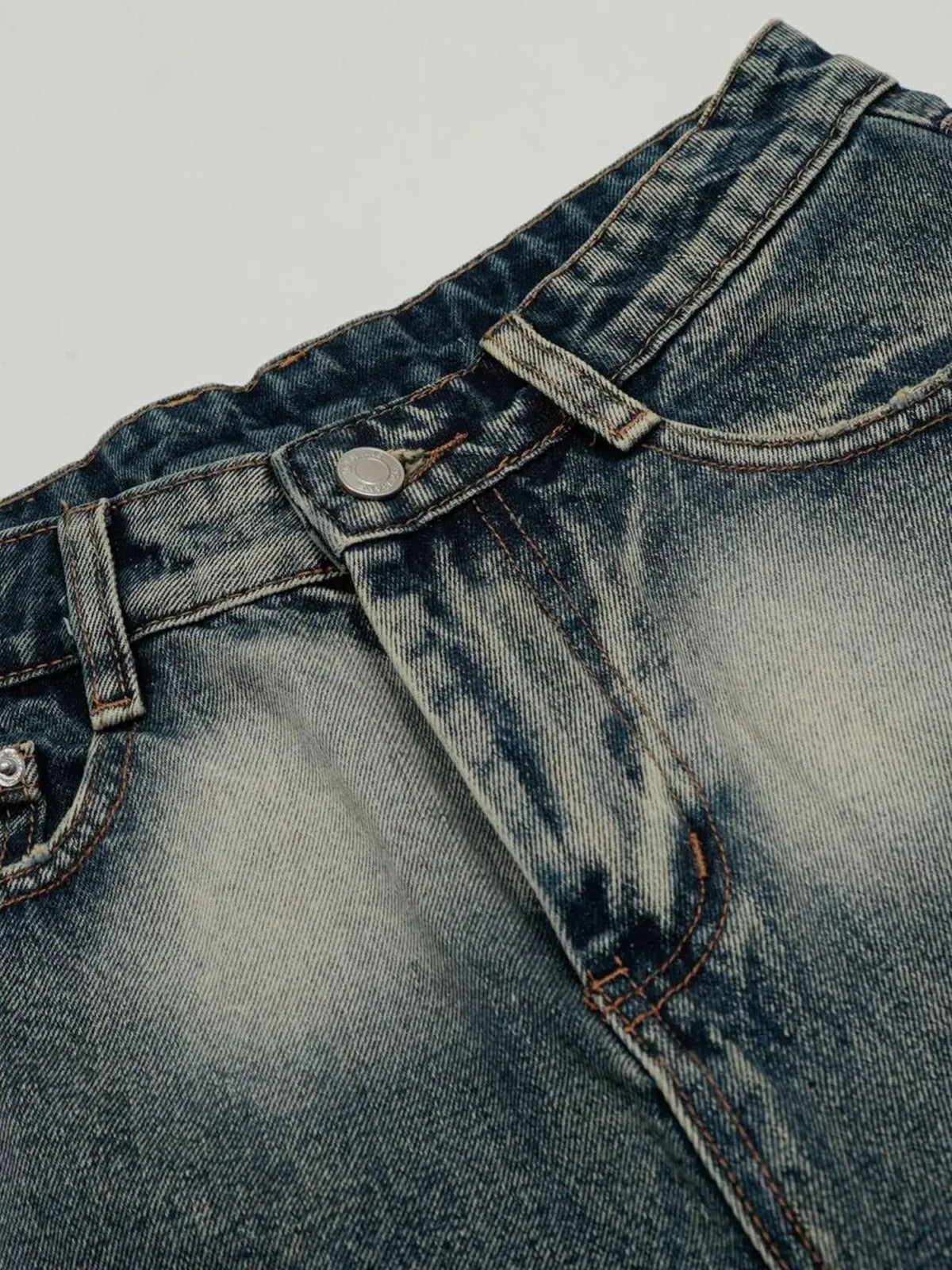 Men's acid-wash denim shorts with stretch cotton blend; blue denim, orange stitching, and metal rivet.
