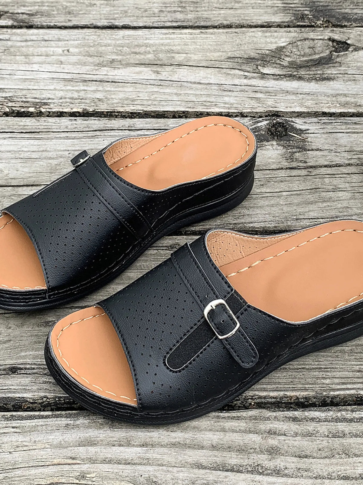 Casual Comfort Buckle Strap Sandals by Trendsi; black perforated leather upper with tan footbed and buckle strap