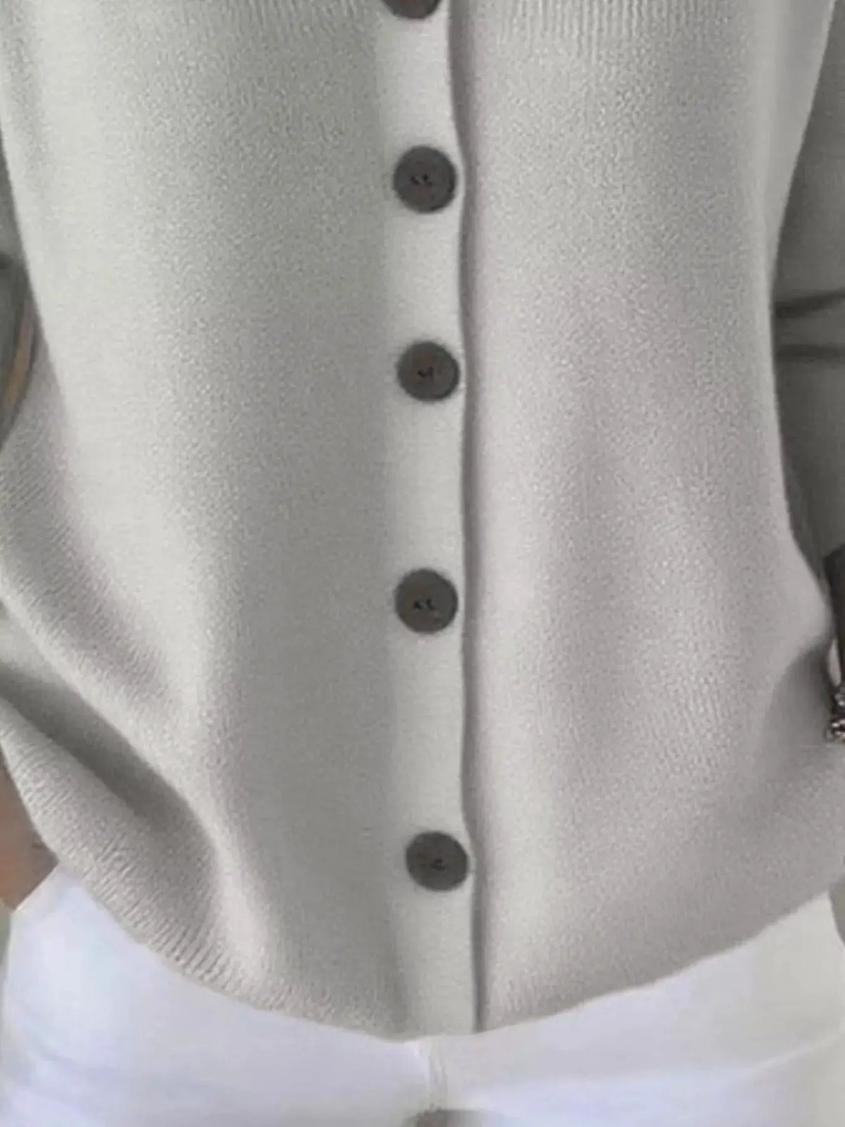 Plus-size button-front soft-knit cardigan by Trendsi in cream.