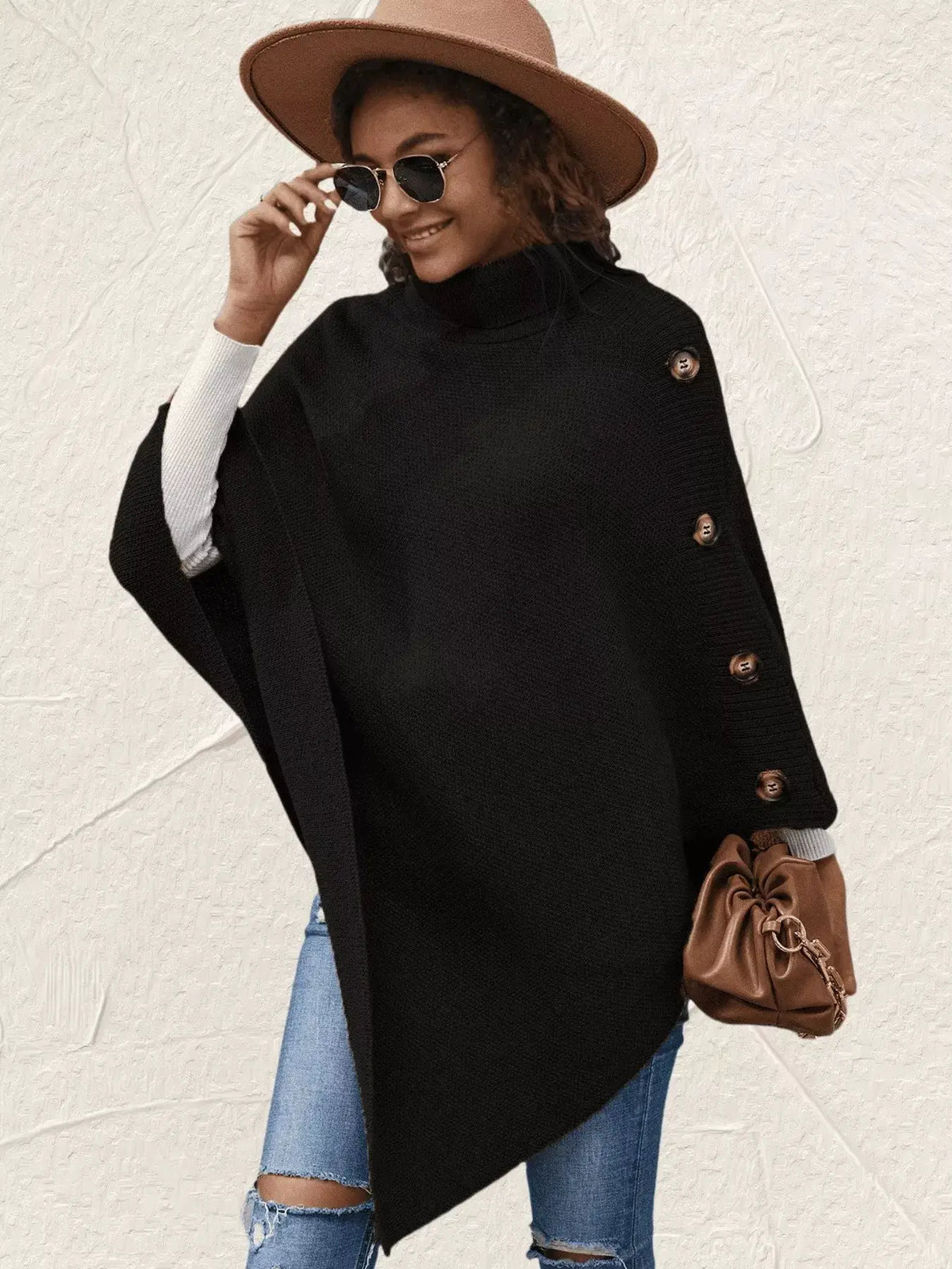 Button turtleneck poncho pullover in black with side brown button accents