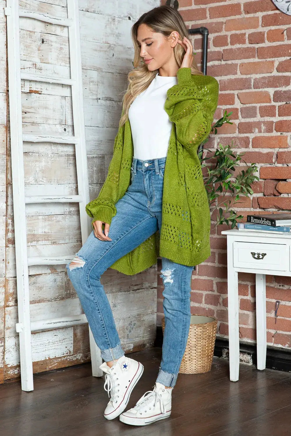 Openwork long-sleeve open-front cardigan by Trendsi, olive green acrylic, worn over white tee with blue jeans.