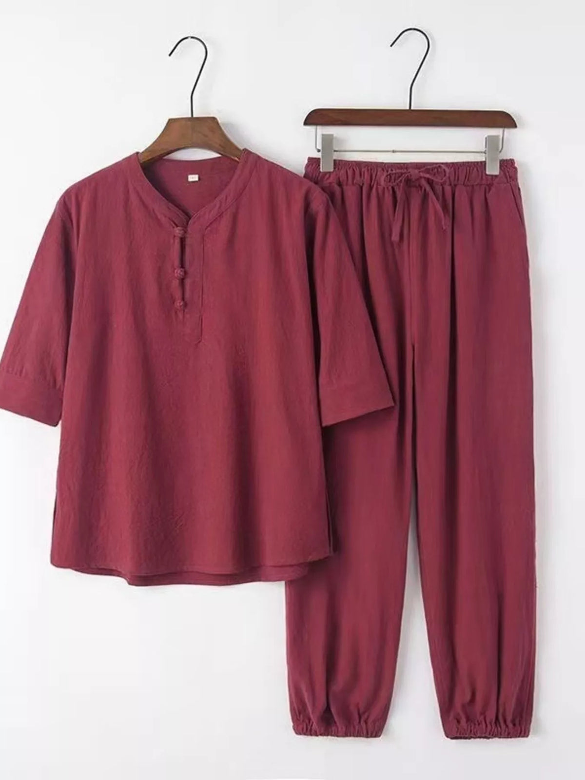 Trendsi men's plus-size burgundy 3/4 sleeve top and pants set; lightweight fabric, elastic waist, cuffed ankles.