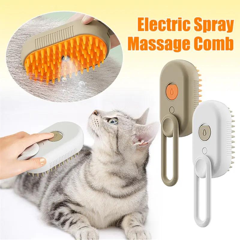 Two AdTec electric spray massage combs for cats, beige and white 3-in-1 pet grooming brushes with orange bristles