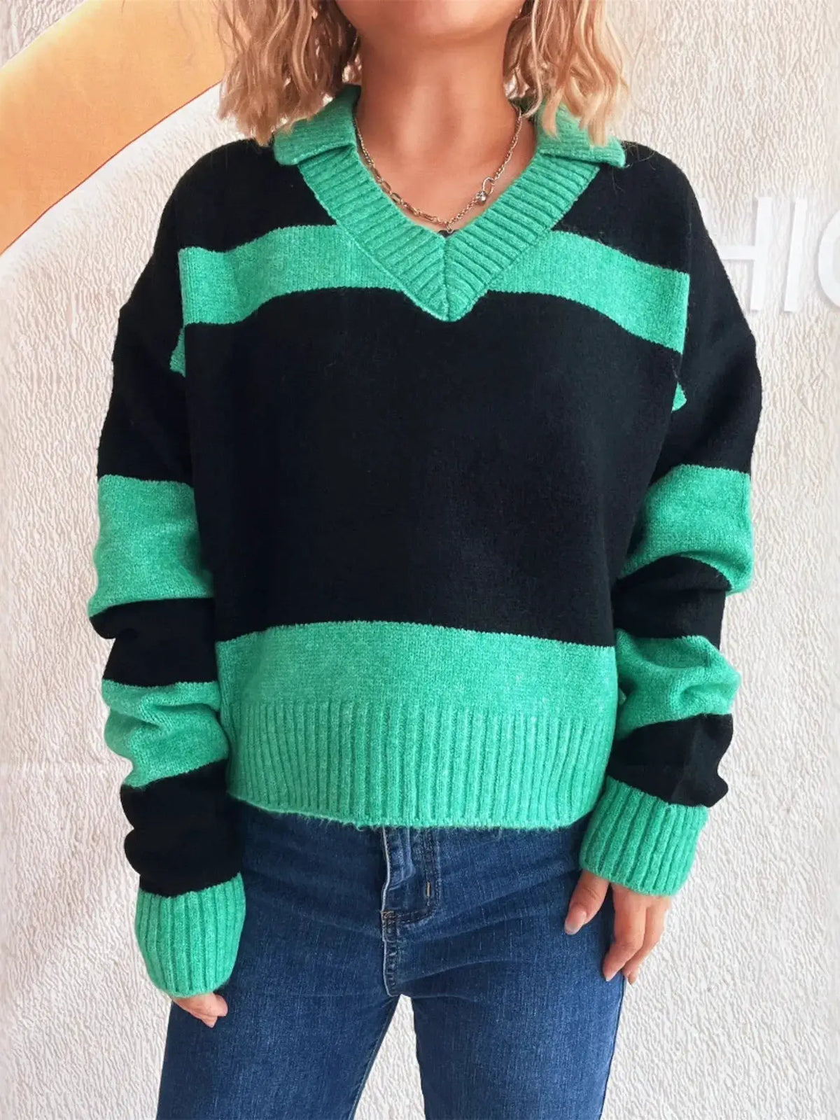 Color block long sleeve sweater in black and emerald green with ribbed V-neck