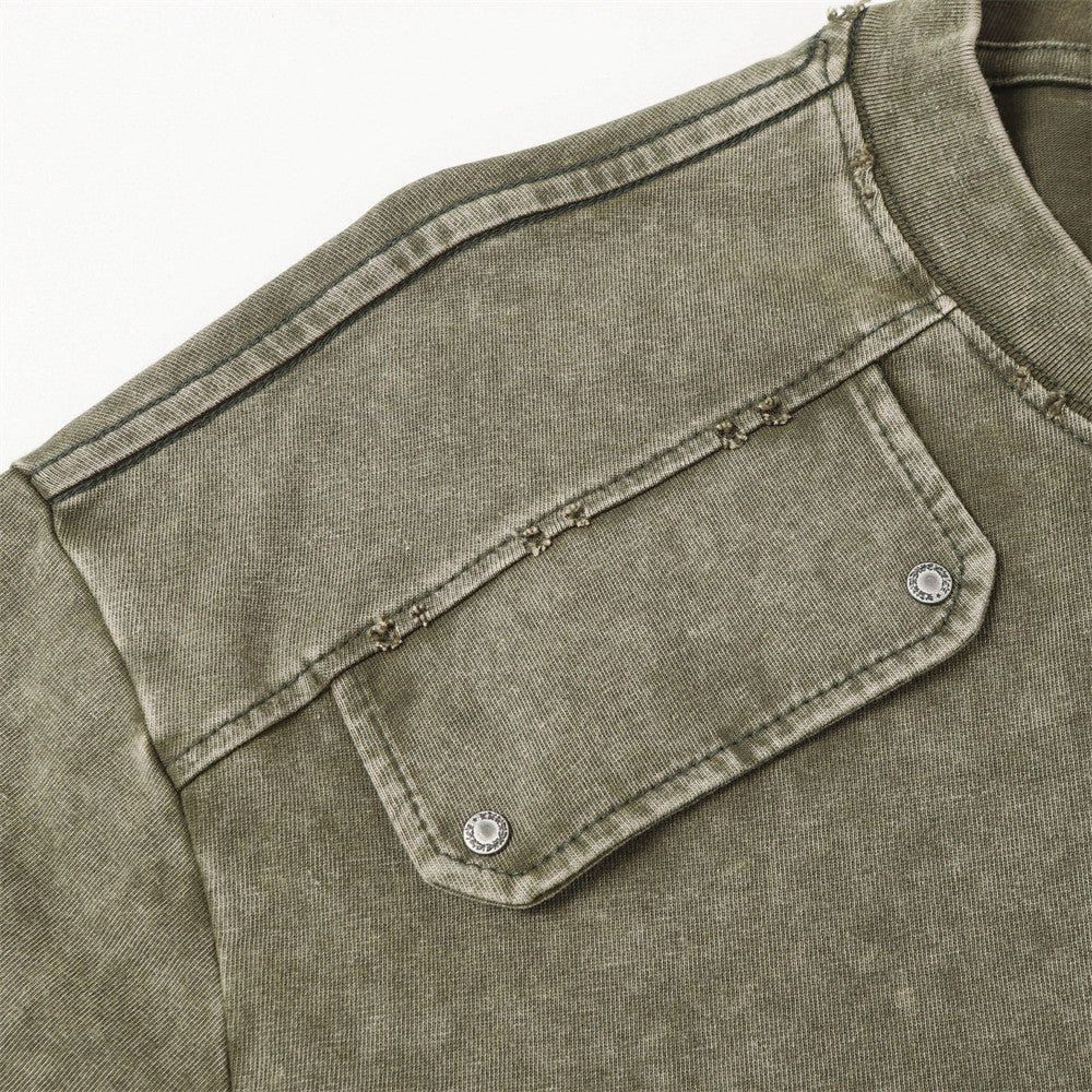 Olive green washed short-sleeved T-shirt with chest pocket and metal snap buttons.