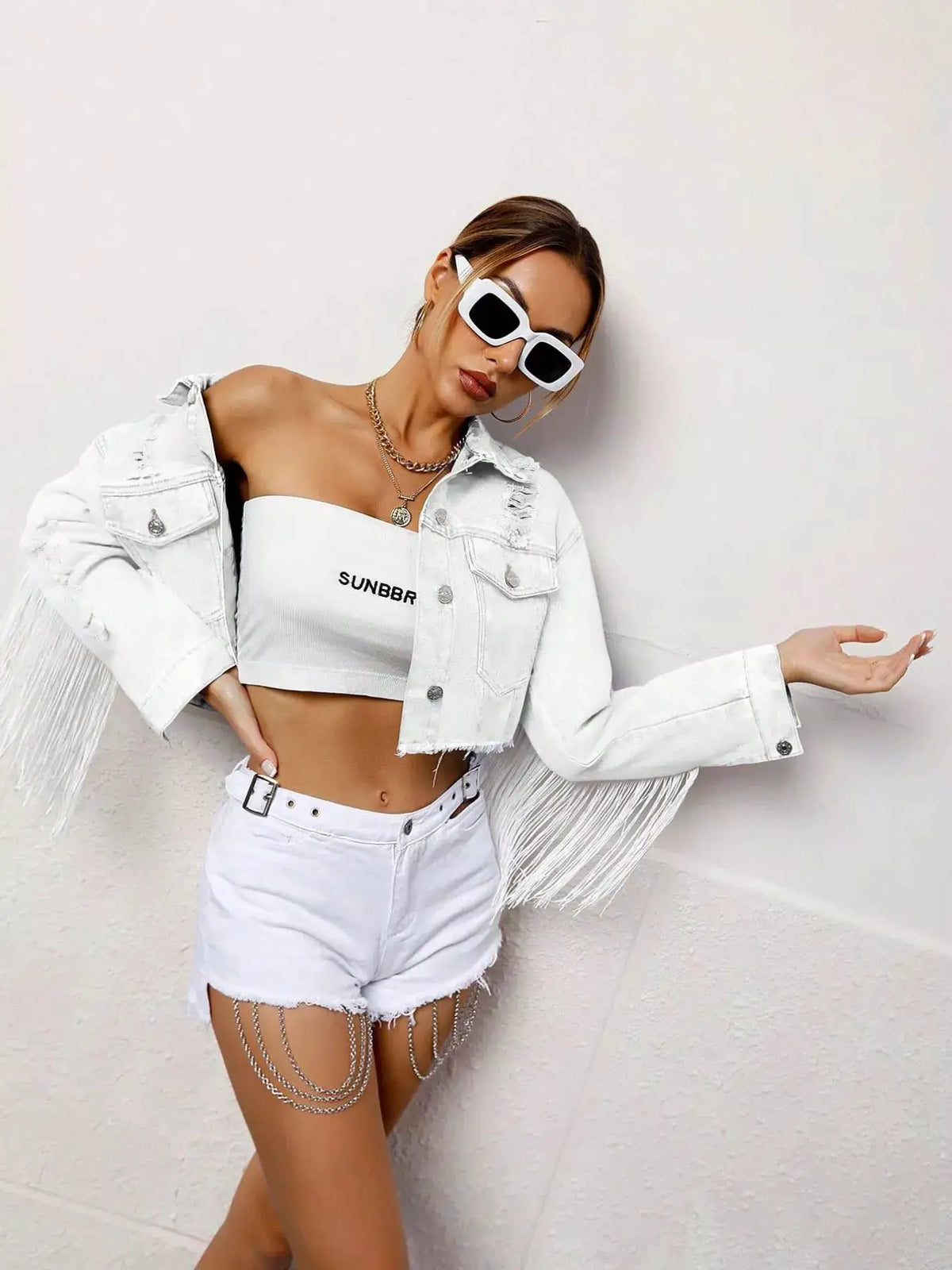 Fringed cropped white denim jacket with button front and tassels