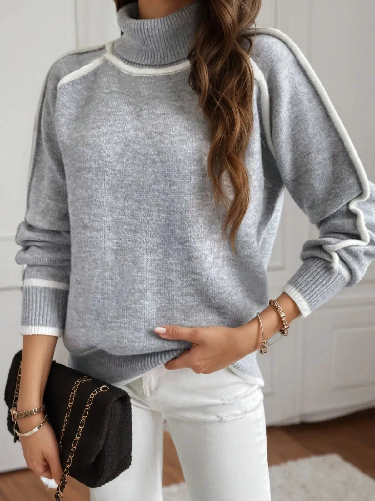 Turtleneck sweater in gray heather with white contrast trim, soft ribbed knit.