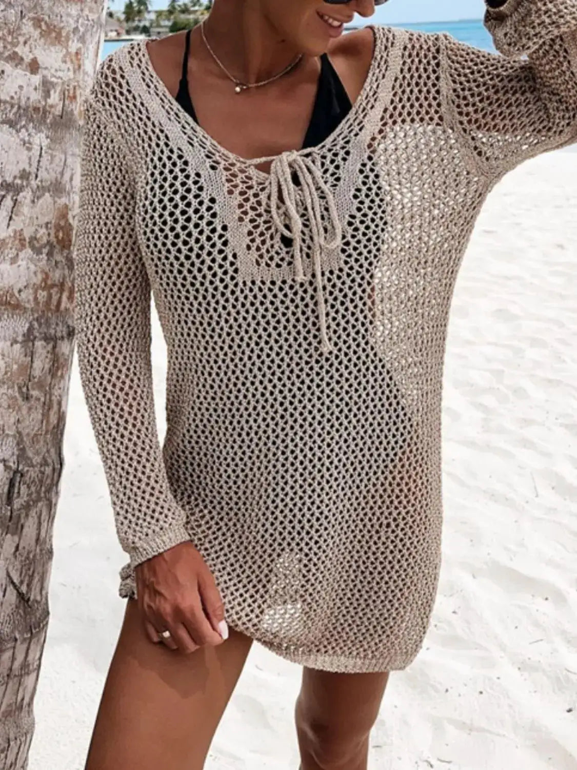 Sheer openwork long-sleeve knit cover-up by Trendsi in beige crochet with tie neckline