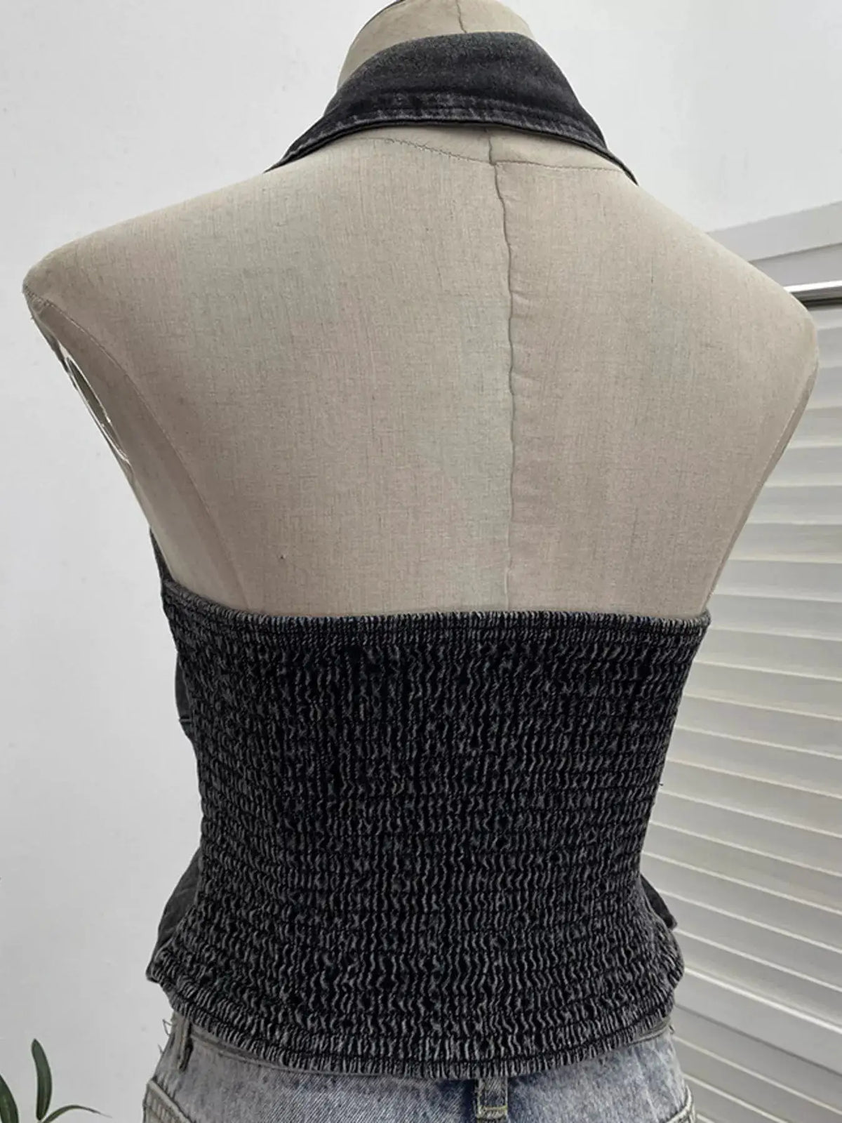 Premium Textured Smocked Denim Halter Top on dress form; dark charcoal fabric with stretch spandex blend