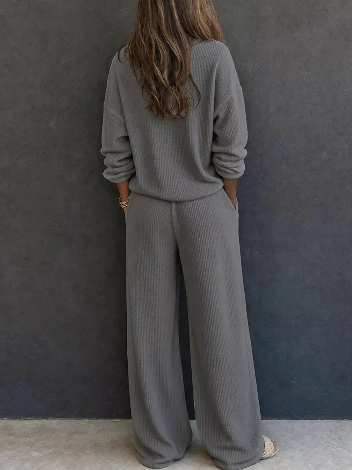 Waffle-knit henley top and wide-leg pants two-piece set by Trendsi in gray.