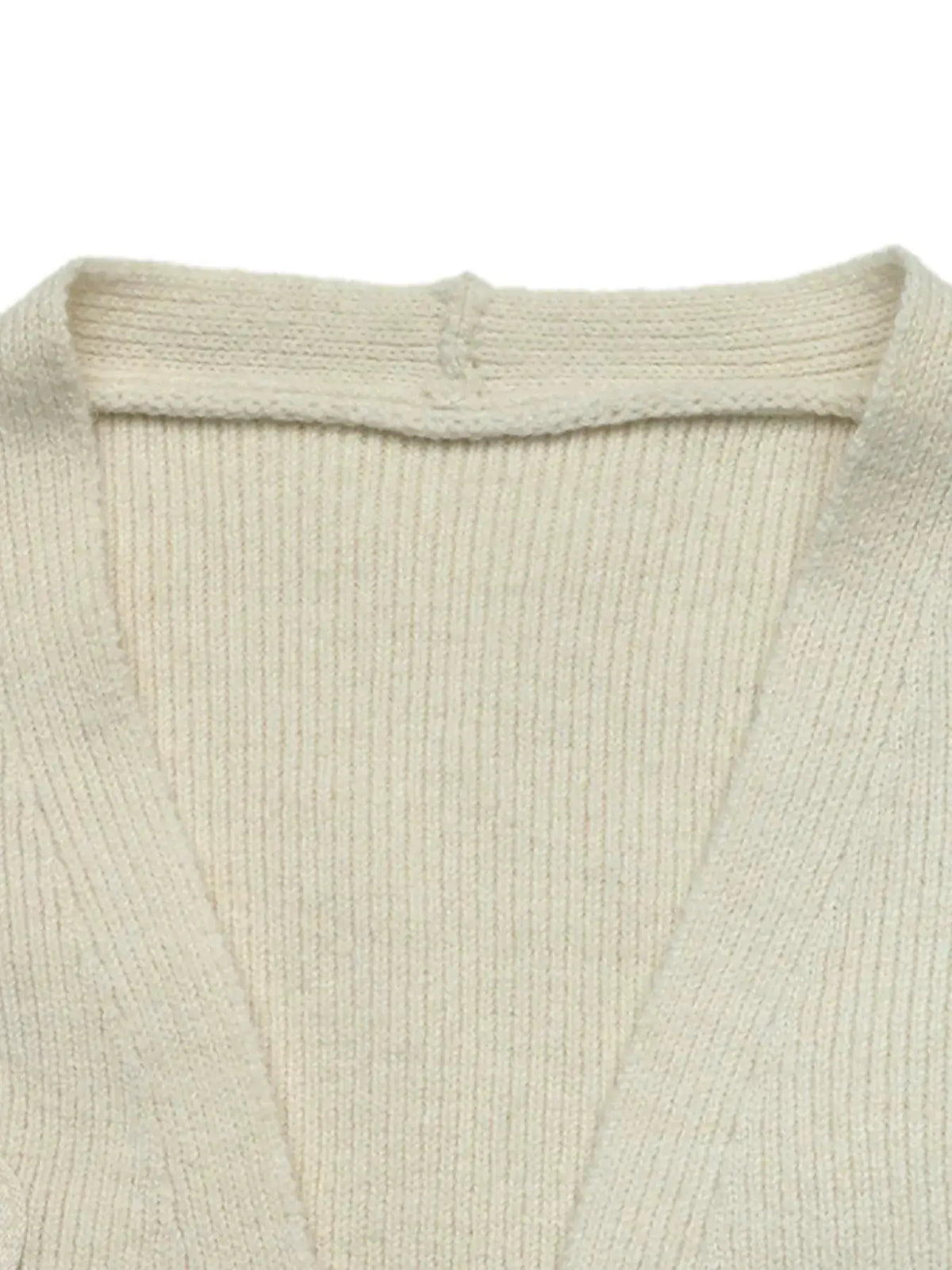 Four-Leaf Clover Open Front Cardigan in cream knit.