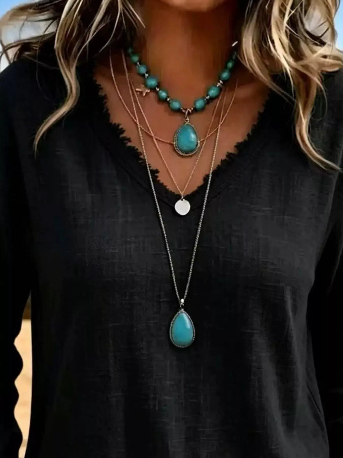 V-Neck Frayed Hem Long Sleeve T-Shirt in black with turquoise beaded layered necklaces