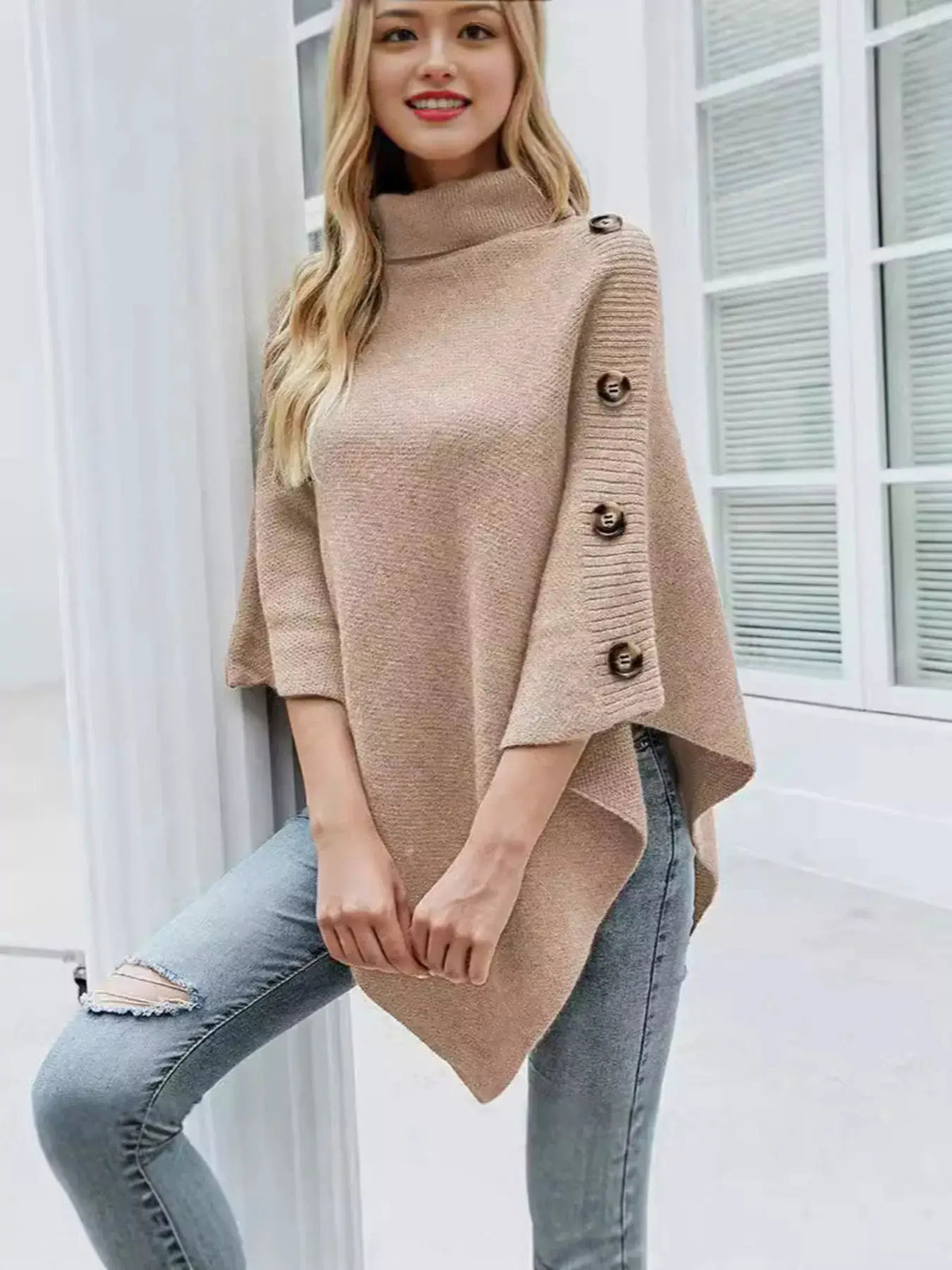 Button turtleneck poncho pullover in beige knit with buttoned sleeves