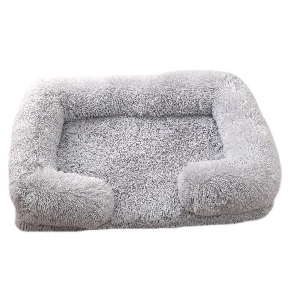 Plush round pet bed with bolstered sides in soft gray; cozy winter dog bed.