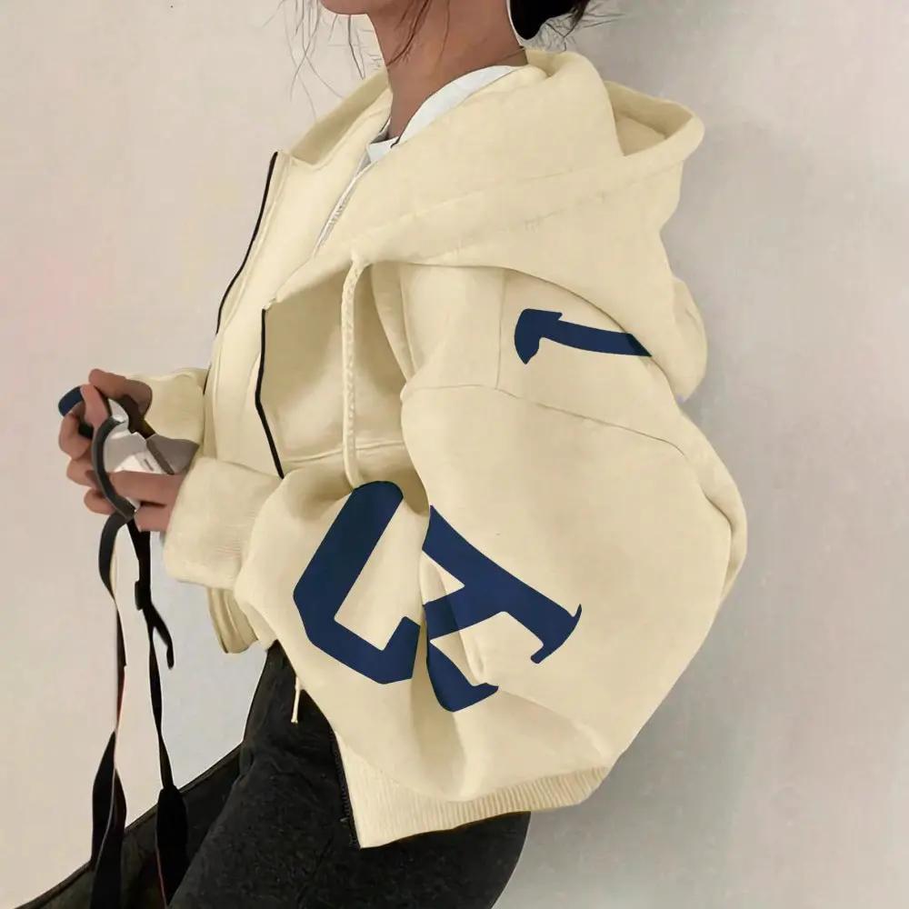 AdTec cream soft full-zip hoodie with oversized sleeves and blue graphic on the sleeve