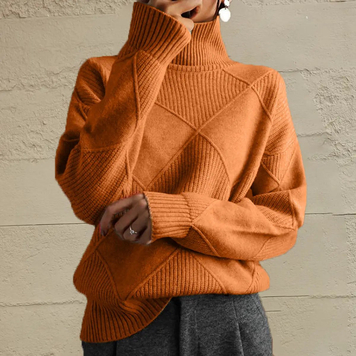 Geometric turtleneck sweater, orange stretch knit, long sleeves with ribbed cuffs