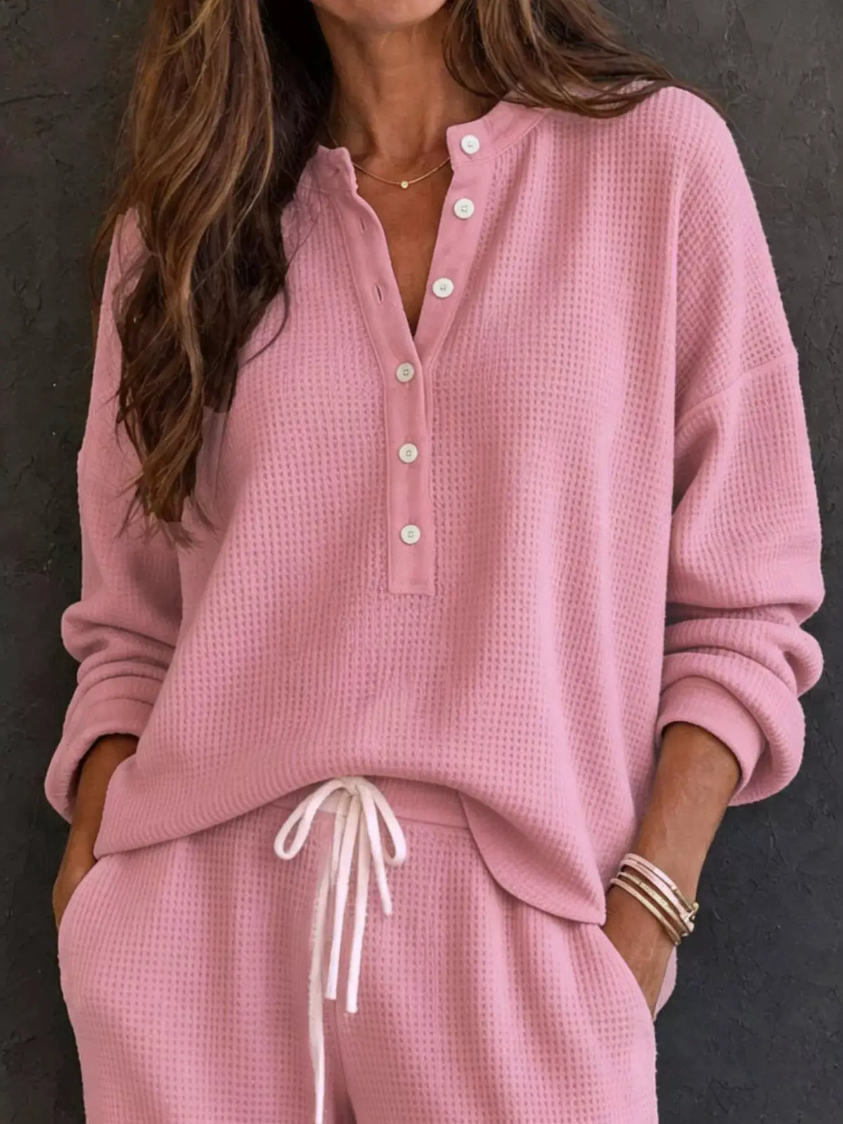 Waffle-knit Henley top and wide-leg pants two-piece set in pink from Trendsi with white buttons and drawstring waist