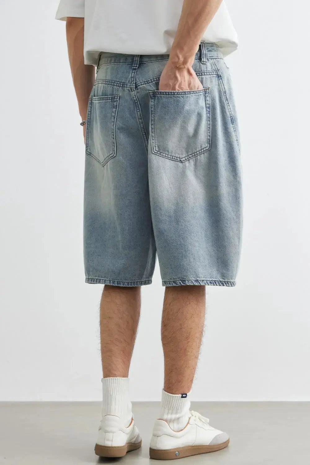 Mens plus-size relaxed-fit stretch washed denim shorts in light blue with back pockets