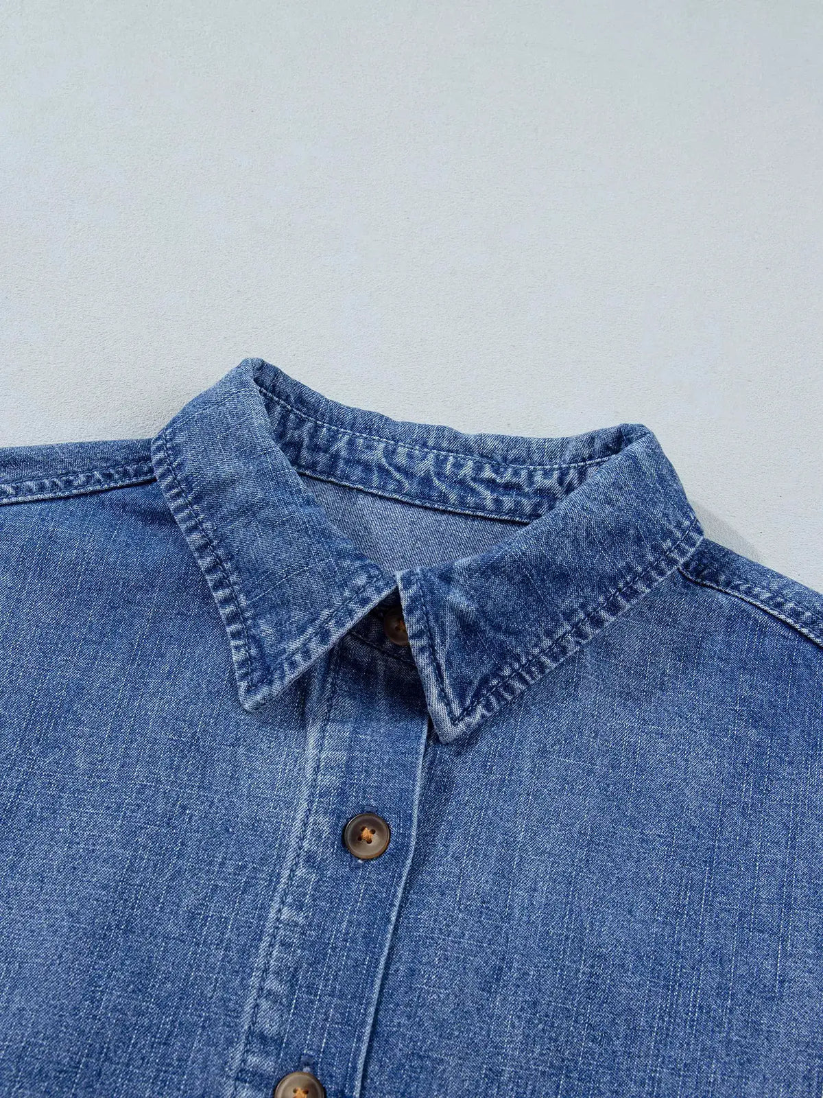 Relaxed denim shirt in blue wash with front button placket and collar