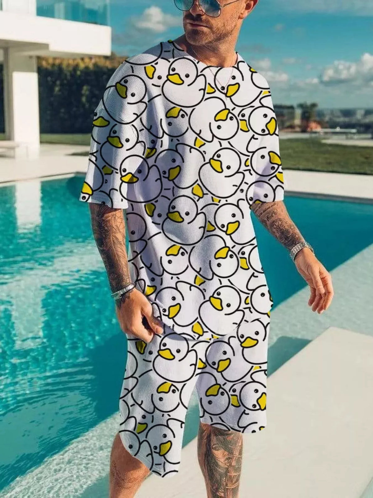 Men's two-piece short-sleeve tee and shorts set; white fabric with yellow duck pattern
