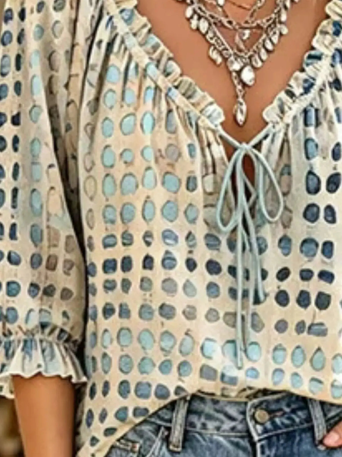 Trendsi plus-size tie-neck blouse, beige with blue polka dots, 3/4 sleeves.