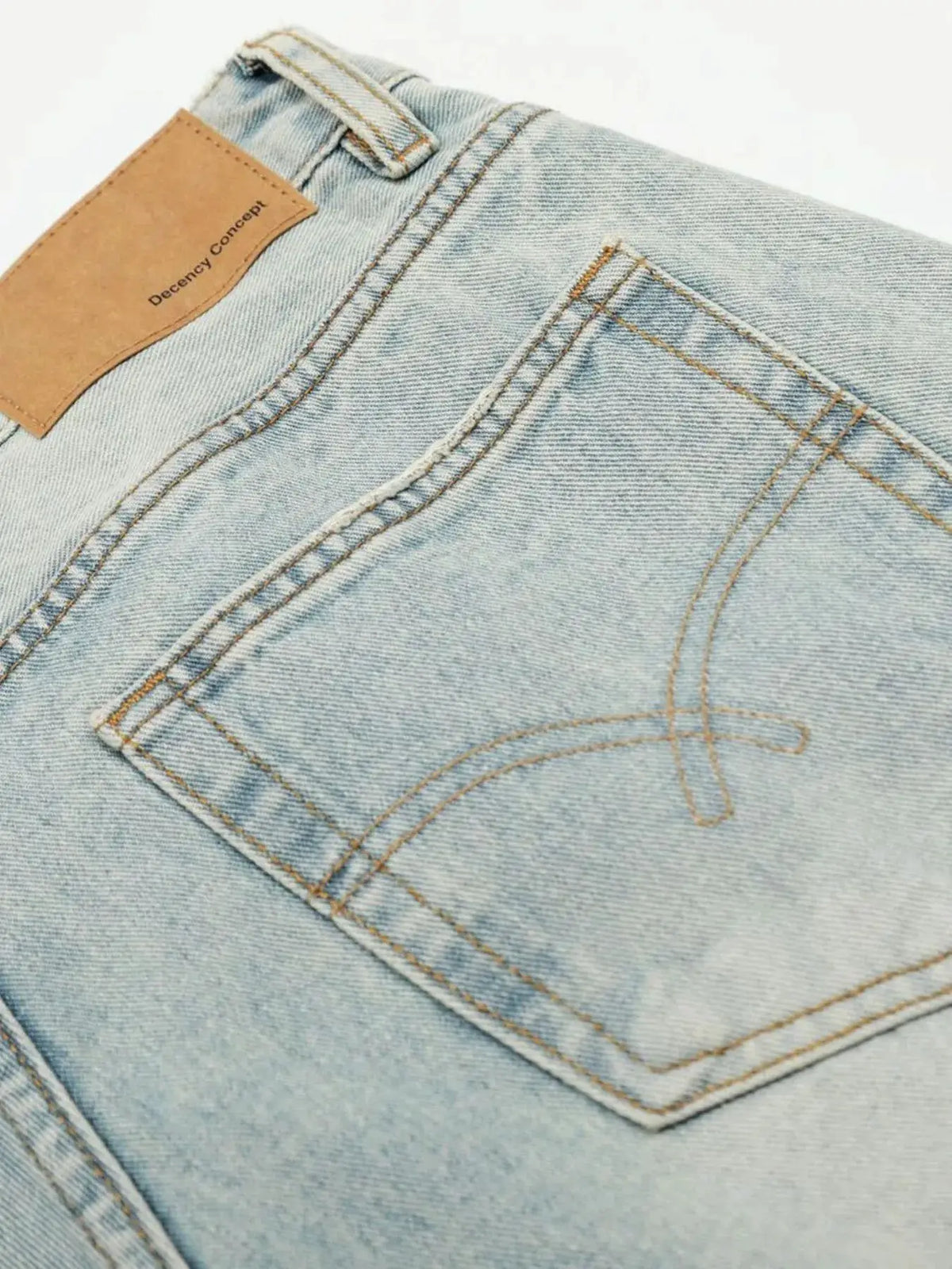 Mens wide-leg denim shorts, light-wash cotton denim with back pocket stitching, Decency Concept patch