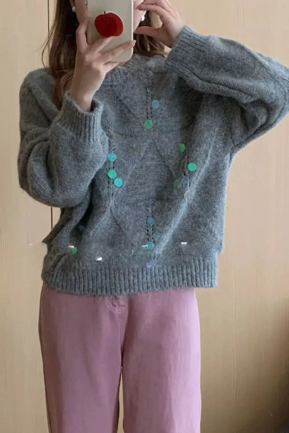 Shimmering sequin round-neck gray knit holiday sweater with long sleeves and ribbed hem