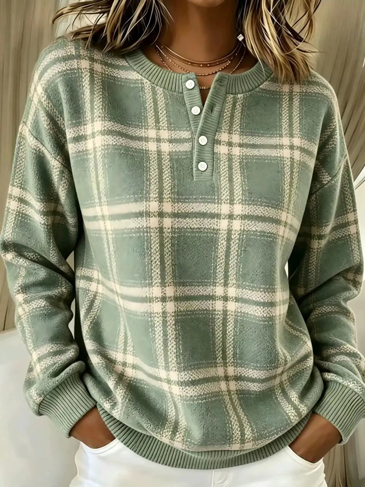 Women's plus-size long-sleeve plaid button-front sweatshirt in sage green and cream with ribbed cuffs and hem.
