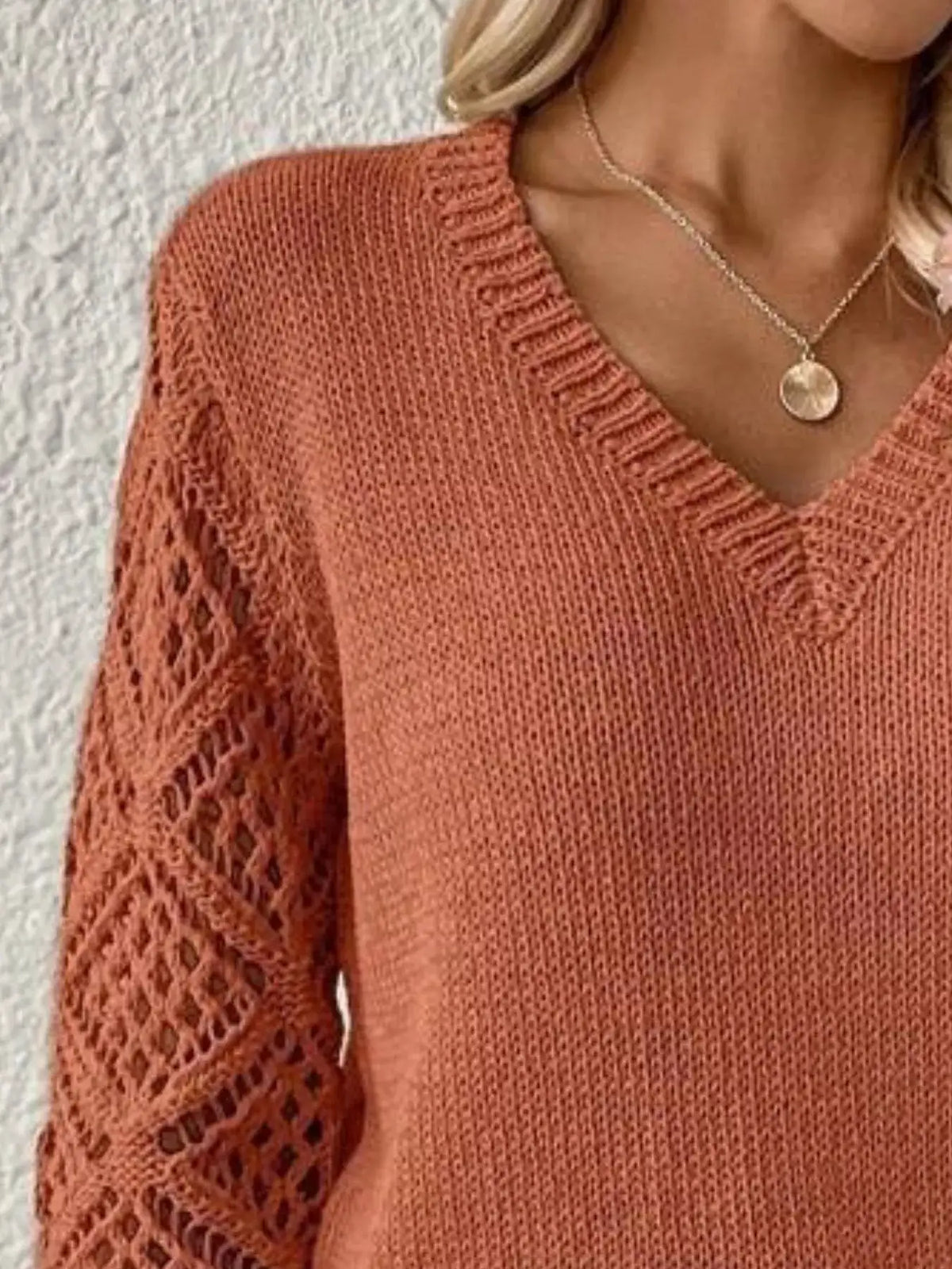 Women's rust V-neck knit sweater with hollow-out lace sleeves, soft polyester.