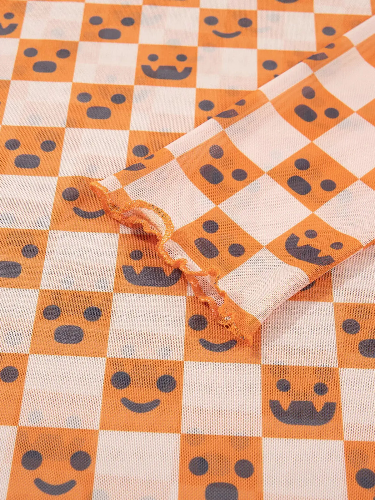 Abstract Halloween Pattern Long Sleeve Mock Neck Blouse in orange and white checker with dark blue motifs.
