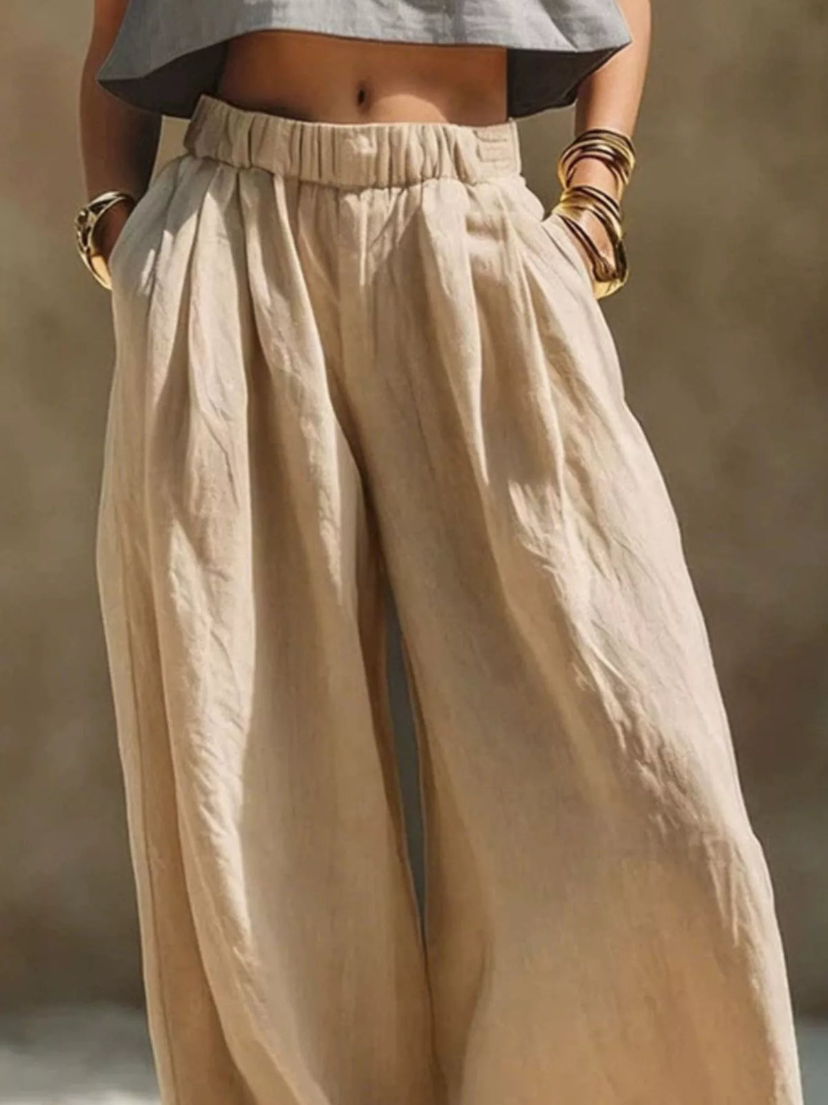 Plus-size beige palazzo pants with elastic waistband, drawstring and pockets